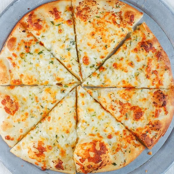 A round Italian garlic bread, cut into eight slices, topped with melted cheese and herbs.
